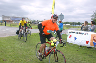 Peter Wilby crosses the Great Yorkshire Bike Ride finish line